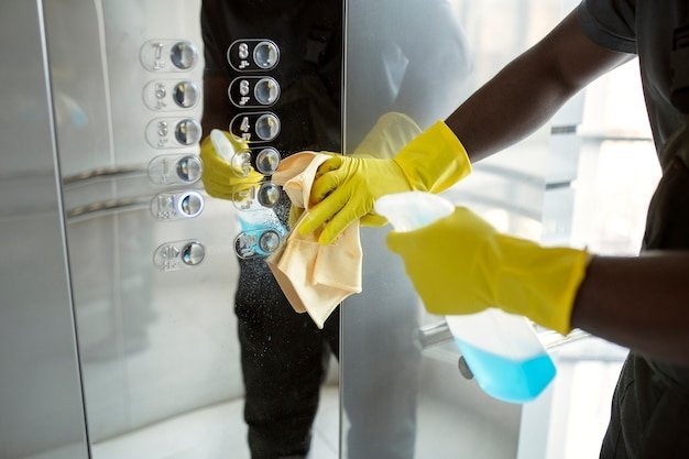 freepicdownloader.com hands cleaning elevator buttons normal